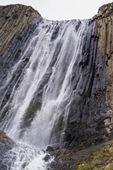 Mountain waterfall in the forest. Waterfall view. Waterfall in mountains. Waterfall pool