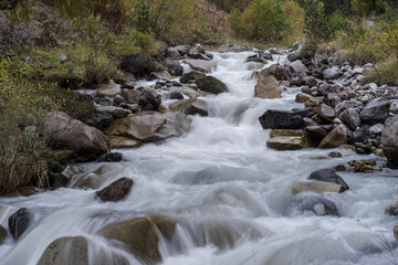 Mountain waterfall in the forest. Waterfall view. Waterfall in mountains. Waterfall pool