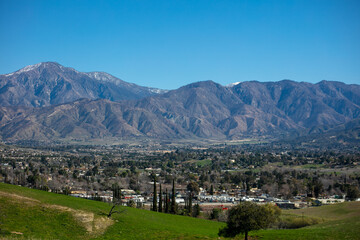 Fototapeta na wymiar A View of a California City, Yucaipa, Below a Mountain from a Valley Overlook