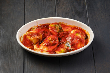 Lamb dumplings with tomato sauce baked in oven