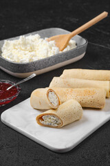Homemade pancakes stuffed with cottage cheese