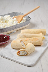 Homemade pancakes stuffed with cottage cheese