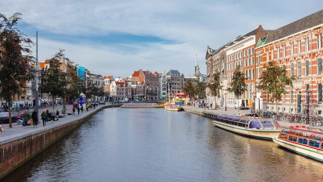 Day Time Lapse with clouds and boats in Amsterdam, The Netherlands
