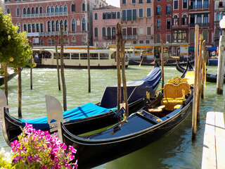Fototapeta na wymiar Italian Gondolas in Venice, Italy, Tied to a Mooring on the Grand Canal