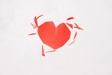 torn heart on a white background. Cheating, disappointment in love, unrequited love concept.