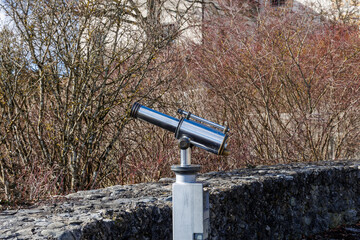 Fixed shiny metal binoculars at a viewpoint near Zeil Castle near Leutkirch in the Allgäu region...