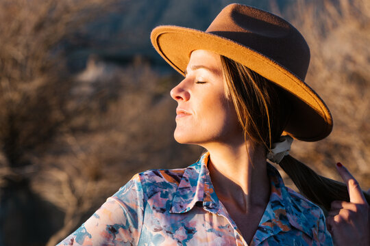 Woman in ht standing in countryside