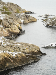 Rocky coastline in winter. Snowy rocks by the sea. In Nyn&auml;shamn, Sweden.