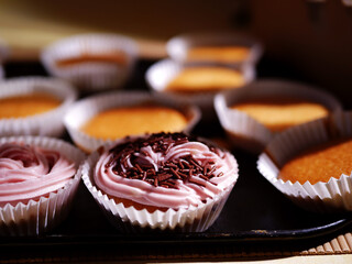Home baked cupcake decorated with pink frosting 