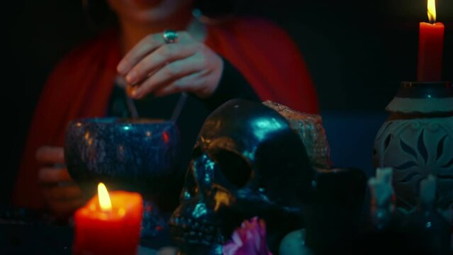 Fortune-teller making magic potions in her cave, magic ritual, psychic powers