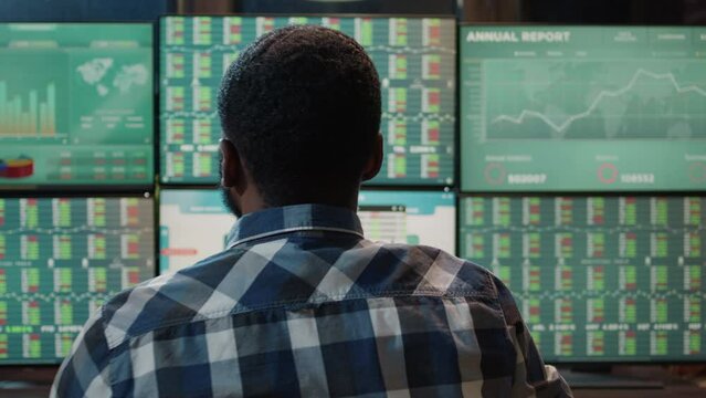 Forex trader analyzing market charts to plan commodities exchange on multi monitor workstation. Financial investment with banking profit statistics and real time stocks changing.