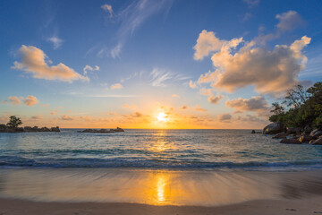 Fototapeta na wymiar Sunset on Petite Anse beach in Constance Lemuria hotel, Praslin island, Seychelles.