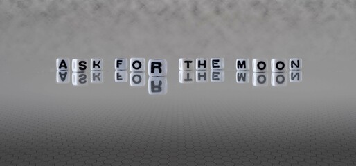 ask for the moon word or concept represented by black and white letter cubes on a grey horizon...
