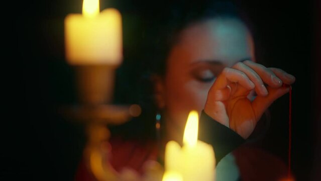 Psychic conducting ritual of searching for person, paranormal eye, witchcraft