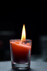 The candle flame in the darkness