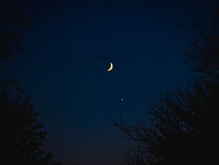 A waning crescent moon in the night sky above Orwell, Ohio