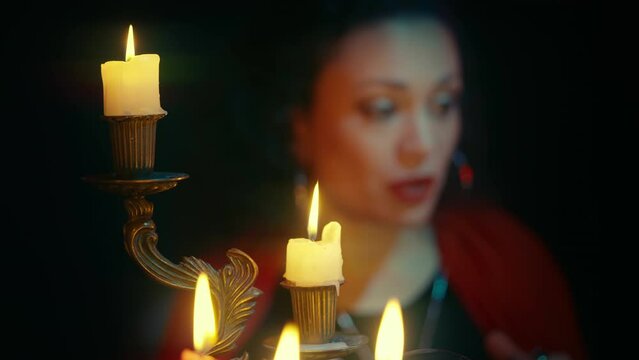Woman giving tarot card advice online using laptop, education for future psychic