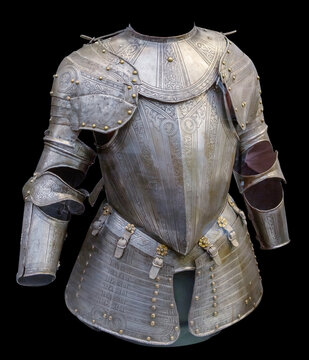 Medieval knight suit of armor protection isolated on black background with clipping path. Ancient steel metal armour