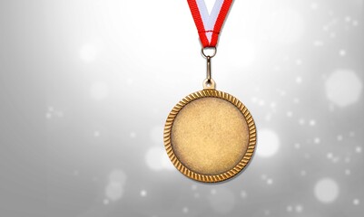Gold medal of the Olympic Winter Games against the background of snowy nature. - obrazy, fototapety, plakaty