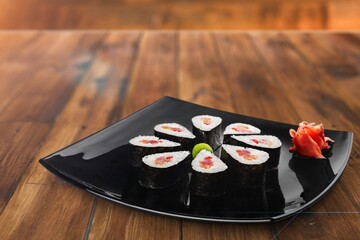 Tasty fresh sushi roll on the desk