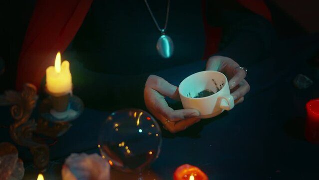 Psychic dealing with coffee fortune telling, forecasting future, divination