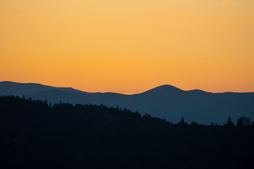 Silhouette of a mountain range at sunset.