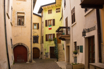 Fototapeta na wymiar A quiet street in winter in the small town of Arco on the North Garda Plain, Trentino-Alto Adige, Italy 