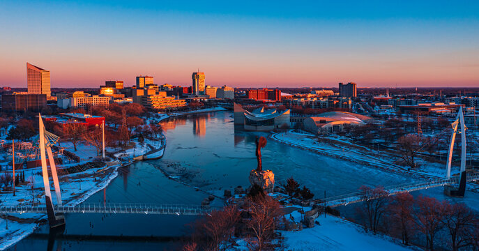 Drone landscape sunset in winter of downtown skyline and Keeper of the Plains in Wichita Kansas