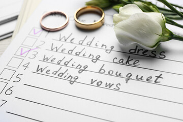 Wedding Checklist, flowers and rings, closeup view
