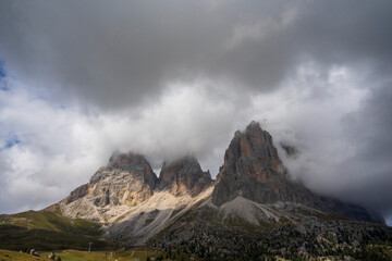 Sassolungo peak under the clouds. Dolomites.