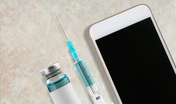 Covid 19 digital immunization record, smartphone and coronavirus complete vaccination