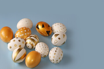 Happy Easter concept, spring card, background. Decorated golden Easter eggs on a gray background. Minimal holiday concept, place for text, banner for screen, template for design,