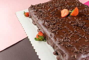 chocolate cake with strawberry and sprinkles