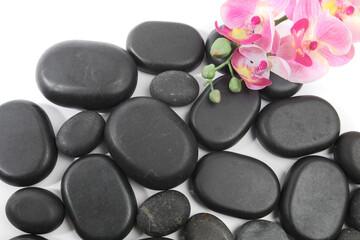 black spa stones isolated on white background .