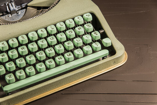A vintage light green typewriter.