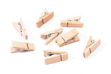 small wooden clothespins on white background - Image