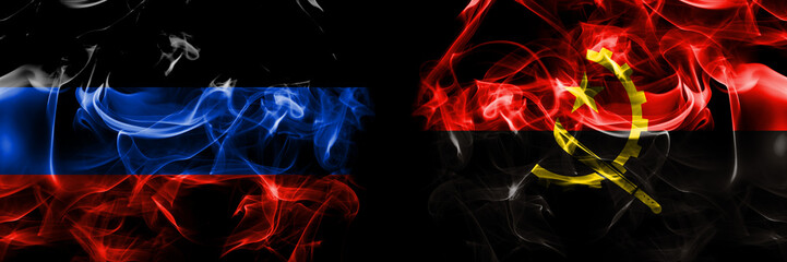 Donetsk People's Republic vs Angola, Angolan flag. Smoke flags placed side by side isolated on black background.