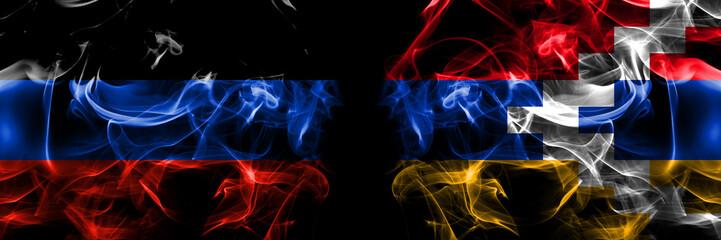 Donetsk People's Republic vs Artsakh, Artsakhtsi, Nagorno Karabakh flag. Smoke flags placed side by side isolated on black background.