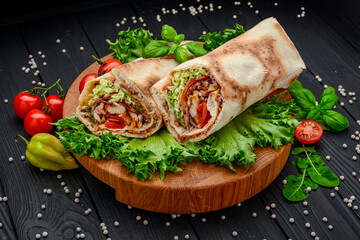 Burrito with grilled beef and vegetables. Shawarma