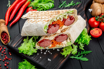 Juicy shawarma with sausages and vegetables.