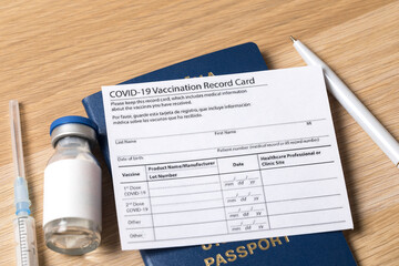COVID-19 vaccination record card and tourist passport  for worldwide travel during coronavirus pandemic. - Image