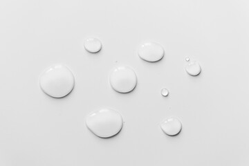 Water drops on white background, top view- Image