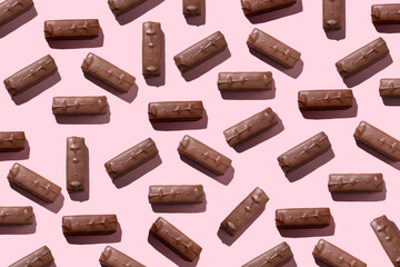 chocolate candies pattern on pink background, Natural sweets. Sweet dessert. Culinary handmade art.