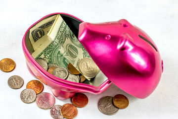 Bright pink pig money box for coins on light background. Economy, budget and savings concept.