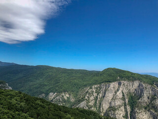 Obraz premium blue sky white clouds on the hill, mountain with a trees view.