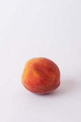 fresh peach on a white meza