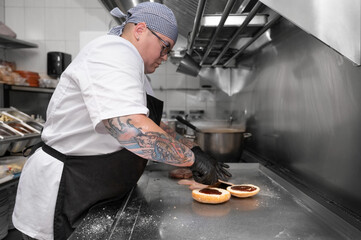 Burger Restaurant. Female Chef Cooking Burgers In Kitchen. High quality photo