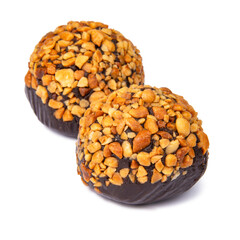 Cake rum truffle two balls with chopped nuts isolated on the white background