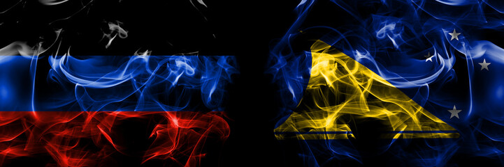 Donetsk People's Republic vs New Zealand, Tokelau flag. Smoke flags placed side by side isolated on black background.