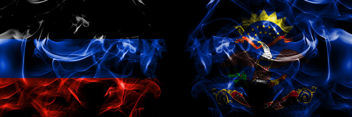 Donetsk People's Republic vs North Dakota flag. Smoke flags placed side by side isolated on black background.